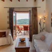 living room with view- traditional stone built villa in chania crete - homes for sale in chania